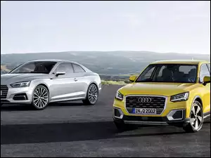 Dwa Audi A5 Coupé rocznik 2017 na tle gór