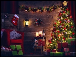 Pokój przystrojony świątecznie z kolorową choinką i prezentami