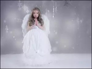 Dziewczynka Aniołek z gwiazdkami i śnieżynkami
