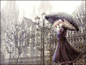 Dziewczyna z parasolem w zimowym mieście