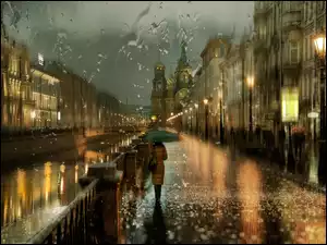 Padajacy deszcz i kobieta na ulicy pod parasolem