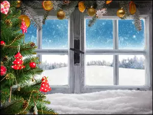 Okno świątecznie przystrojone i choinka w śniegu