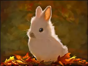 Słodki biały króliczek w kolorowych jesiennych liściach