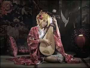 Azjatka z chińskim instrument strunowym- pipa