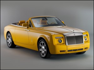 Żółty samochód Rolls Royce Phantom Drophead coupe