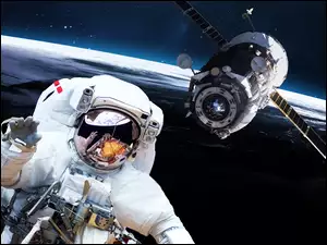 astronauta pozdrawia ludzi Ziemi