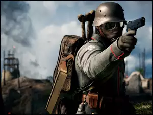 Żołnierz w masce gazowej i z pistoletem w dłoni w grze komputerowej Battlefield 1