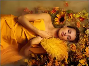 Śpiąca kobieta w słonecznikach