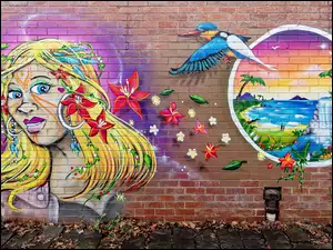 Graffiti z kobietą i ptakiem