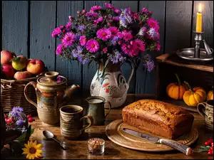 Jesienna kompozycja z jabłkami, bukietem kwiatów i babką