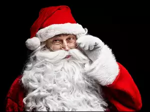 Święty Mikołaj z okularami i czerwoną czapką