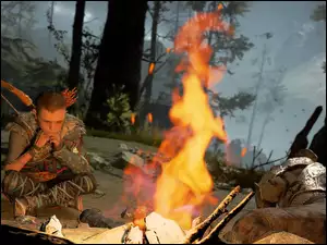 Atreus przy ognisku w grze God of War