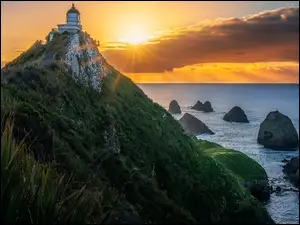 Latarnia morska, Nugget Point Lighthouse, Nowa Zelandia, Morze, Otago, Promienie sĹoĹca, SkaĹy
