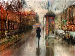 Kobieta pod parasolem na ulicy w deszczu