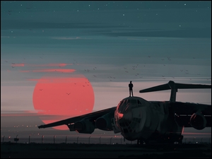 Mężczyzna na samolocie o zachodzie słońca