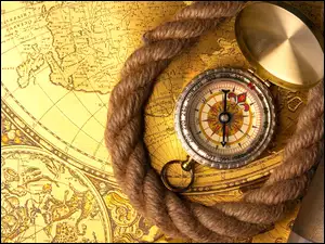 Kompas i sznur na mapach