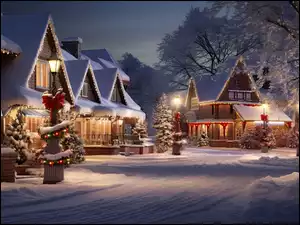 Domy w śnieżnym krajobrazie Bożonarodzeniowym w nocy