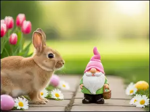 Królik oboktulipanów i pisanek orazkrasnal obok małego koszyczka z pisankami